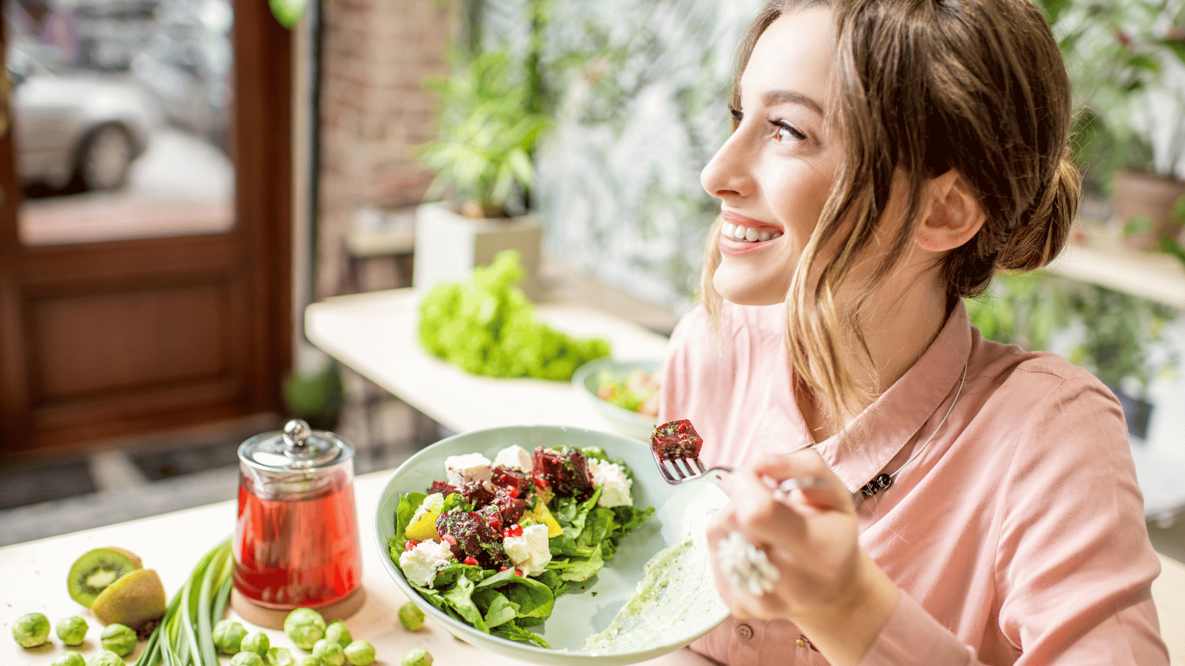 Woman enjoying a salad outdoors in a casual setting